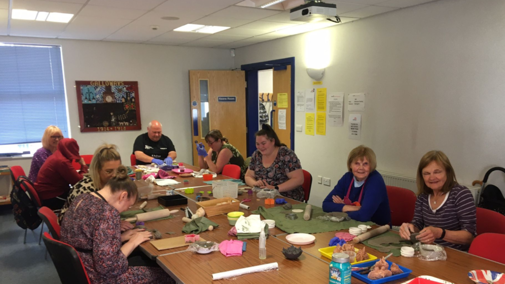 A group session enjoying pottery.