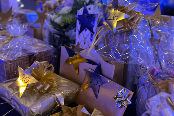 A table of beautifully wrapped raffle prizes