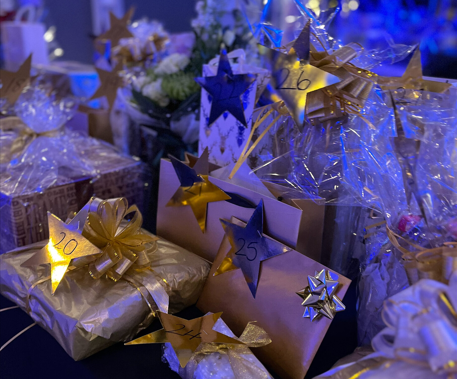 A table of beautifully wrapped raffle prizes