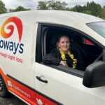 A Galloways staff member sitting in the driving seat of the Galloways van