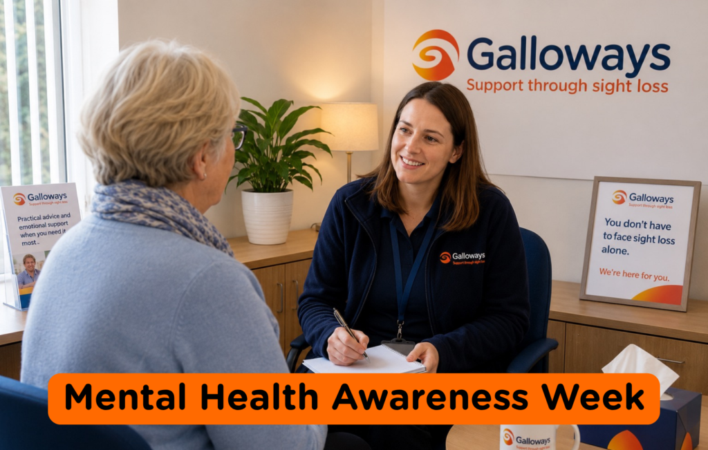 Galloways support worker speaking with an older woman in a welcoming office setting during Mental Health Awareness Week, highlighting emotional support and wellbeing services for people living with sight loss.