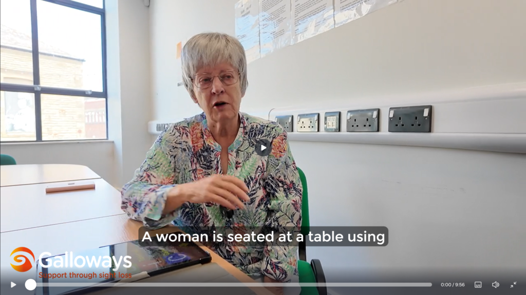 A woman demonstrates the Synapptic accessibility interface on a tablet using touch gestures and spoken feedback.
